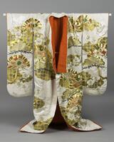 Embroidered kimono with a cream background and gold, green, and orange embroidery depicting trees and flowers. The interior is orange and the bottom hem is stuffed. 