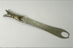 Sword with a wooden "X" shaped handle and a metal blade terminating in two points that curve inward. 