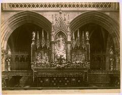 This photograph depicts an altar in an intricately decorated cathedral. 