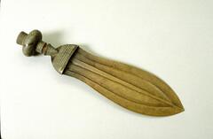 Knife with leaf-shaped blade and wooden handle. Handle consists of multiple geometric patterns and intersecting lines.