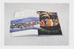 Image of a book lying open to a page featuring a painting of men in brightly colored robes with their backs to the artist. A newsclipping featuring a photo of people in an over-crowded boat lies on the book across the open page.  