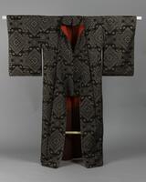 <p>brown and light gray Ooshima tsumugi kimono with interwoven geometric motif consisting of a combination of fujimon (wisteria) and karahana (stylized chinese flower) motifs with a red and red-brown inner lining.</p>
