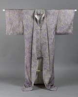 <p>pale green-yellow and lavender shibori kimono with blurred patterning with a white and lavender gradated inner lining. This kimono was made by Sansai Saitou.</p>

