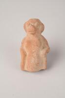 A terracotta figure of a monkey.
