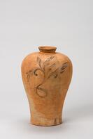 <p>This is a maebyeong decorated in underglaze iron brown. As the glaze was not su ciently fused during ring, the vase has a bright yellow-brown hue. Two large oral scrolls are decorated on the two sides of the body in iron brown. Its glazed surface is dull due to insu cient fusion and glaze had shivered in many parts, revealing the body. The foot is low but with a wide rim. This type of greenish-brown glazed celadon decorated in iron brown was produced in large quantities around the areas of Jinsan-ri, Haenam-gun, Jeollanam-do.<br />
[<em>Korean Collection, University of Michigan Museum of Art</em> (2014) p.138]</p>
