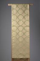 Reversible brocade obi with medallion patterns in gold-leafed paper (kinran) and pale yellow silk floss.