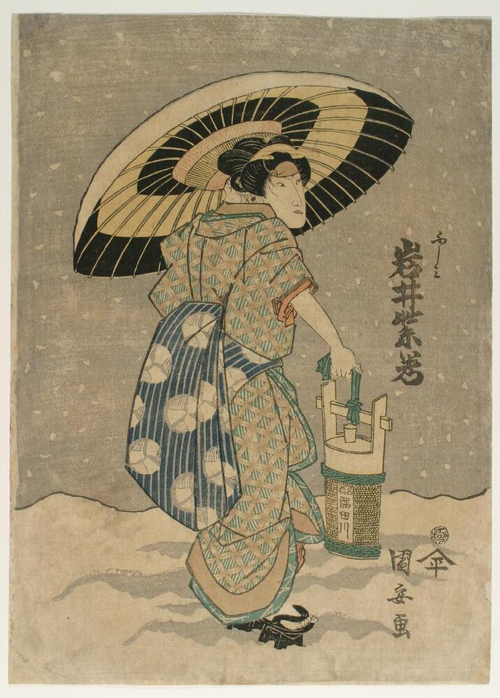 In this print, a woman walks under an umbrella in the snow.  She wears an orange and green checked robe with a blue sash and carries a bucket by a rope (with name Sumidagawa) in her right hand.  The sky in the background is dark, and snow is falling.<br />
 <br />
Inscriptions: Artist’s signature: Kuniyasu ga; Publisher’s seal: Hei; Censor’s seal: Kiwame; Fushimi, Iwai Shijaku