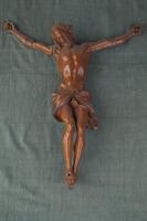 Wooden scultpure of the body of Jesus Christ as it would appear crucified on a cross.