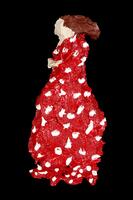 Figure of a woman wearing a long dress made in papier-m&acirc;ch&eacute;; features painted in acrylic paint; dress is red stippled with white; hair is brown; signed on the back &ldquo;1986 For Herb &amp; Dorothy Vogel from Claudia DeMonte.&rdquo;