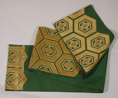 Dark green plain weave silk with embroidered hexagonal design in couched greenish-gold and yellow-gold wrapped threads