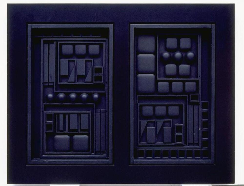 Square, rectangular, and circular pieces of wood and formica are assembled in rectilinear, cabinet-like compartments. The entire object is painted black.