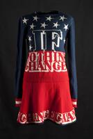 Long sleeve knit sweater, navy blue on top and red on bottom with red and white striped cuffs on the sleeves. There is a pattern of white stars on the front of the sweater, along with the words IF NOTHING CHANGES outlined in white. The back of the sweater also has a pattern of white stars along with the words 2008 IT CHANGES NOTHING outlined in white.