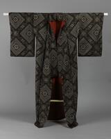 <p>brown and light gray Ooshima tsumugi kimono with interwoven geometric motif consisting of a combination of sarasamon (square floral) motifs with a red and red-brown inner lining.</p>
