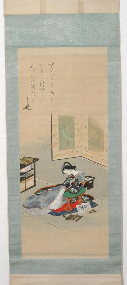 As the title suggests, this hanging scroll depicts a courtesan reading a book of erotica while being watched by a monk. This colorful painting is suspended in sky blue patterned silk. The focus of the painting, the woman, is colorfully painted with robes of many colors and designs. Her hair is tied in a purple cord in a half up half down look. The back of her neck is exposed away from the viewer. In the center of the painting, she rests on a green armrest with three books below it. Behind her is a translucent screen where the face of the monk can be seen. Above the scene to the upper left is a three-lined inscription. The fourth and last line is the artist&#39;s signature placed slightly lower than the rest of the inscriptions.&nbsp;