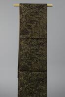 <p>Dark brown fukuro (single-sided) Ro obi with interwoven pale green and gold wisteria and grass patterning.</p>
