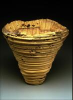 rough-hewn oversized wood bowl in natural state with spalt, marks, holes, etc.
