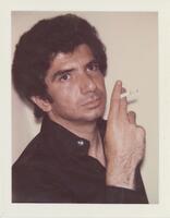 A bust-length portrait of a man. He wears black and holds a cigarette in his hand, lifiting it toward his mouth. 