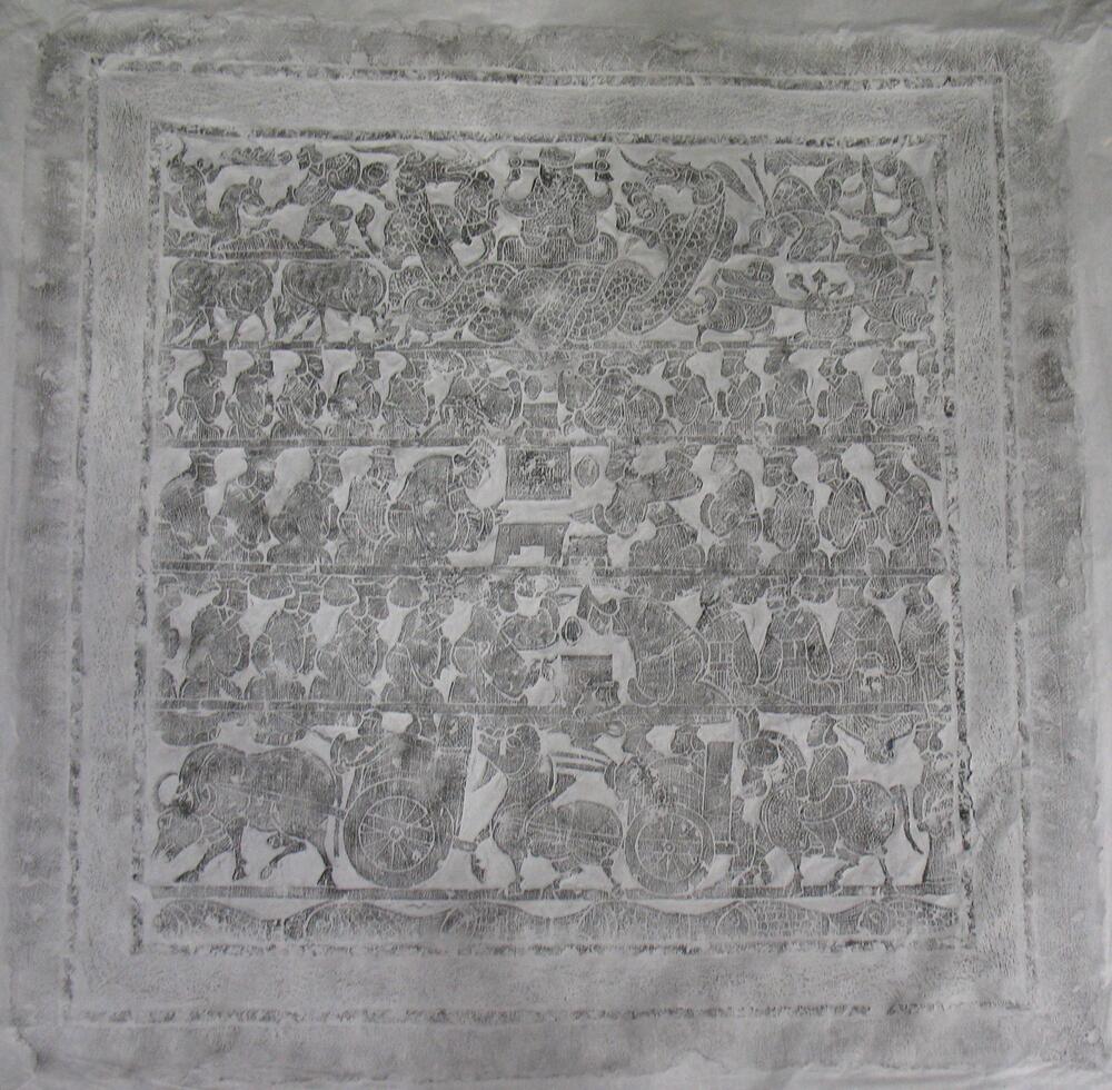 Rubbing of limestone slab carved bas-relief with six registers.  The lower register depicts a chariot procession above fish-inhabited waters.  The central three registers depict figures carrying out funerary rites.  The top register shows a winged creature with a human face flanked by two writhing dragons and other animals, including two rabbits and a nine-tailed fox. <br />