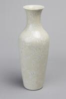 Vase with creamy white glaze and slender neck that flares out.