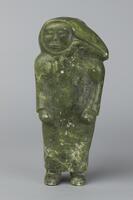 A figure of a standing woman with her arms at her sides. &nbsp;