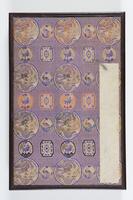 Album of twenty-one double leaves of calligraphic text bound in silk with violet and orange designs and medallions.